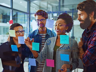 Professionals engaged in a collaborative decision-making process using the six principles of Decision Quality to ensure data integrity.
