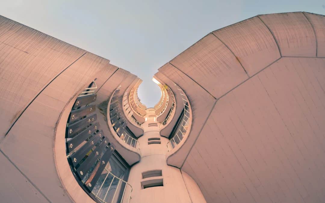 View of a curvy building from the ground