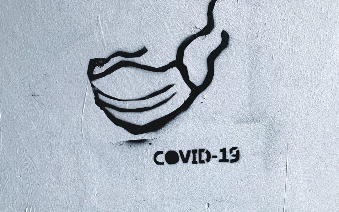 Stenciled mask with COVID-19 written under it